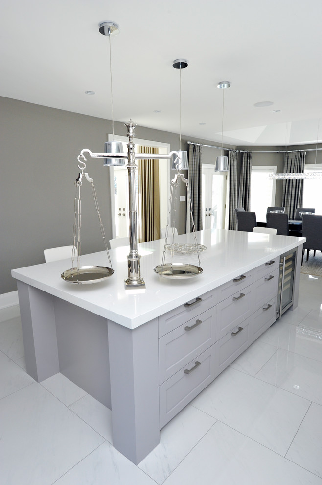 Mid-sized transitional l-shaped porcelain tile kitchen pantry photo in Toronto with a double-bowl sink, shaker cabinets, gray cabinets, quartz countertops, white backsplash, stone slab backsplash, stainless steel appliances and an island