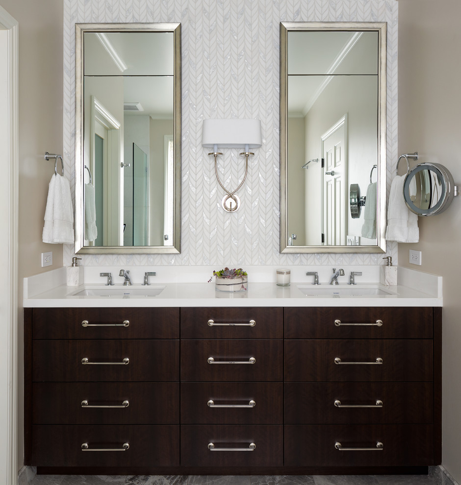 Photo of a mid-sized transitional master bathroom in San Francisco with dark wood cabinets, white tile, beige walls, white benchtops, flat-panel cabinets, marble and an undermount sink.