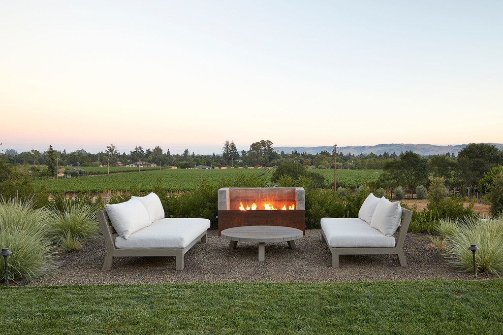 Inspiration for a large country backyard patio in San Francisco with a fire feature, gravel and no cover.