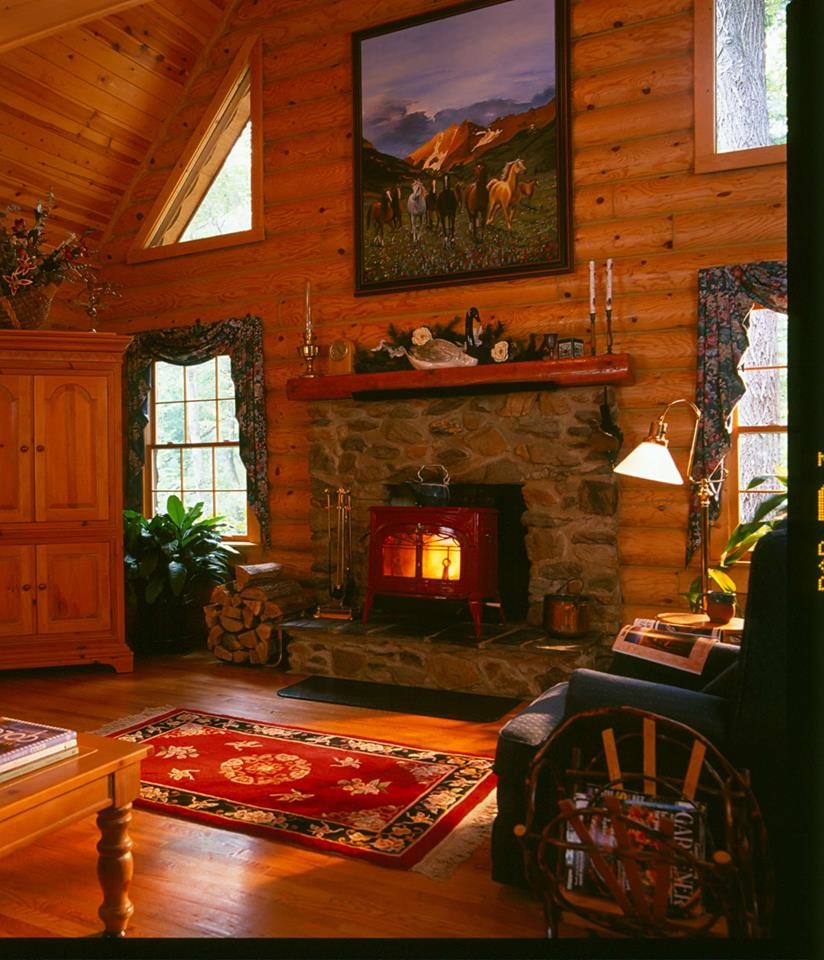 Example of a mountain style open concept light wood floor home design design