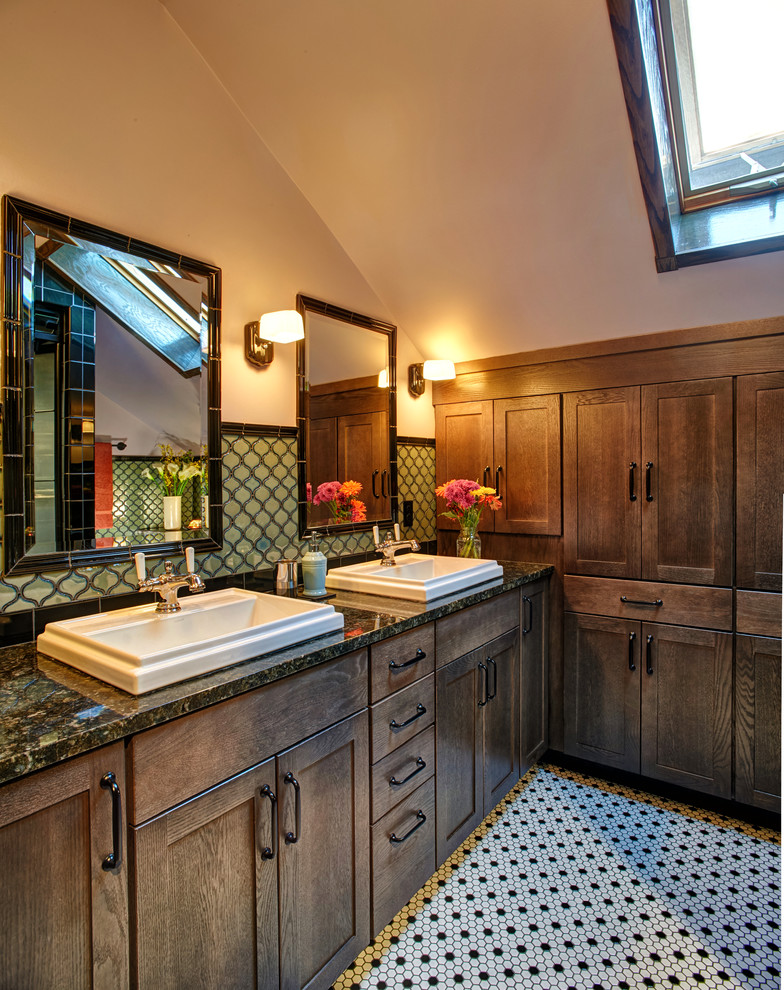 Inspiration for a mid-sized contemporary master bathroom in Other with recessed-panel cabinets, dark wood cabinets, an alcove shower, a two-piece toilet, green tile, ceramic tile, purple walls, ceramic floors, a drop-in sink, granite benchtops, black floor, a hinged shower door and black benchtops.