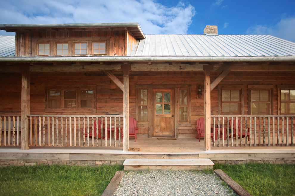 Mountain style single front door photo with a medium wood front door