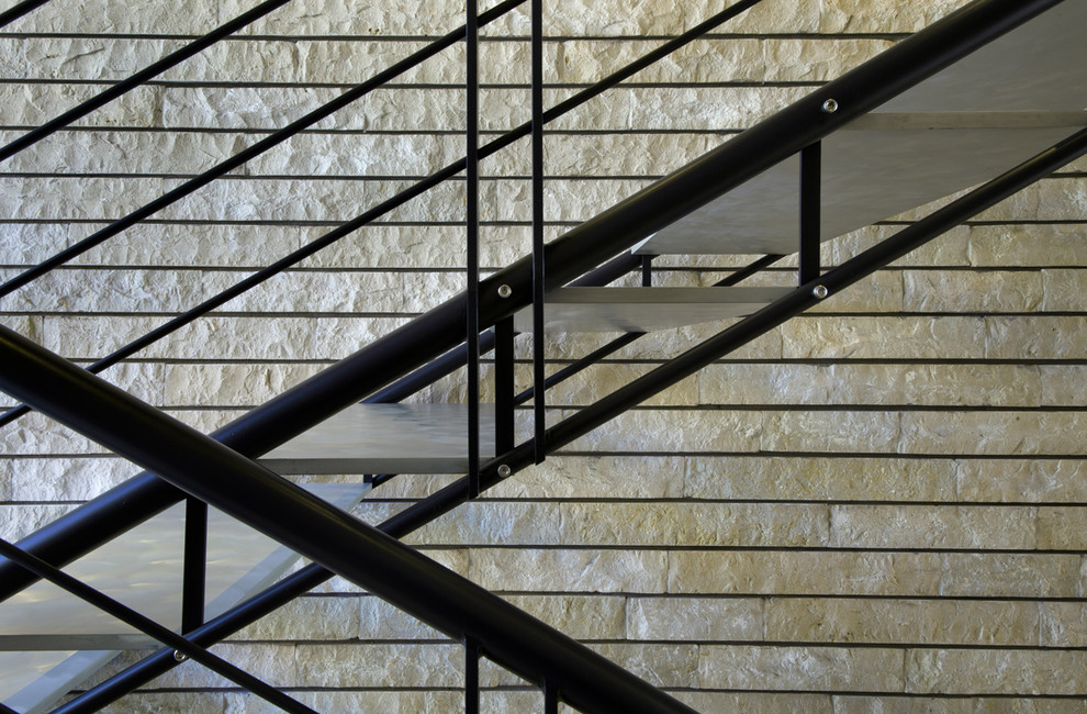 This is an example of a contemporary metal staircase in Phoenix with open risers and metal railing.