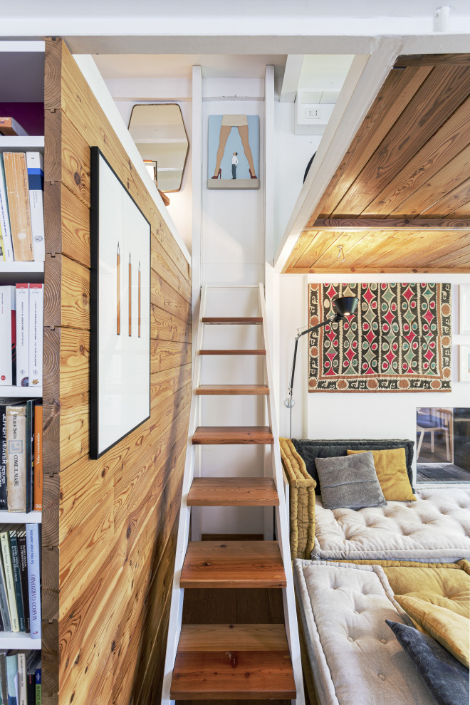 Expansive contemporary wood straight staircase in Milan with wood walls.