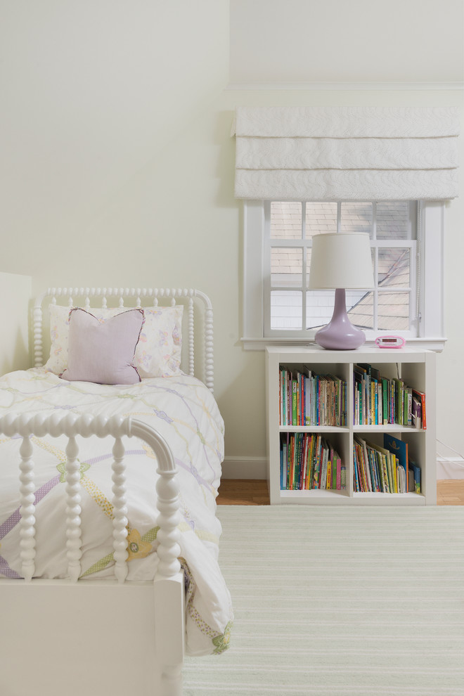 This is an example of a transitional kids' bedroom for kids 4-10 years old in Boston with white walls.
