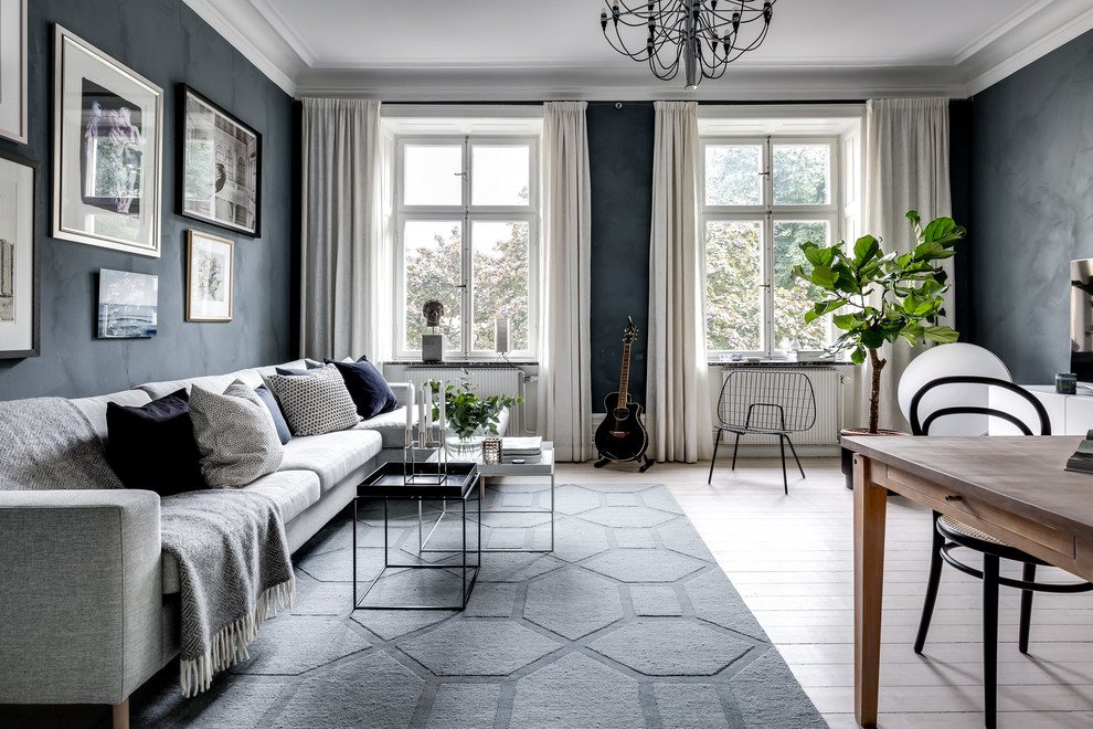 Inspiration for a scandinavian formal enclosed living room in Stockholm with black walls.