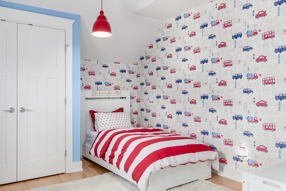 Design ideas for a mid-sized transitional kids' room for boys in Vancouver with multi-coloured walls and medium hardwood floors.