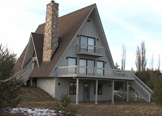 Mid-sized transitional gray two-story concrete fiberboard exterior home idea in Milwaukee