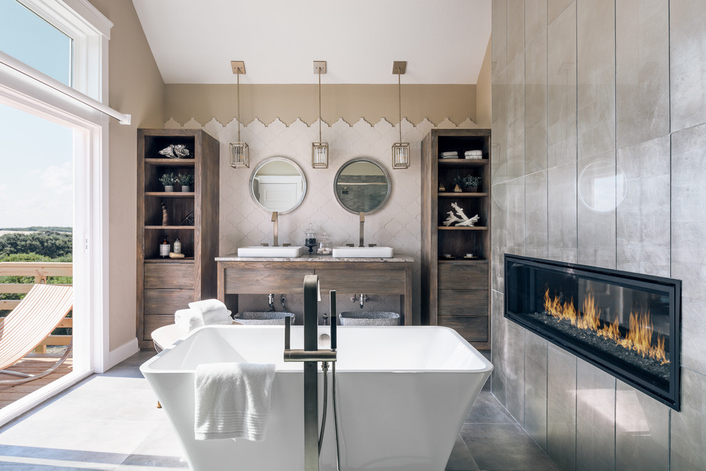 Large minimalist master white tile and ceramic tile ceramic tile and gray floor freestanding bathtub photo with flat-panel cabinets, distressed cabinets, a one-piece toilet, beige walls, an undermount sink, granite countertops and a hinged shower door