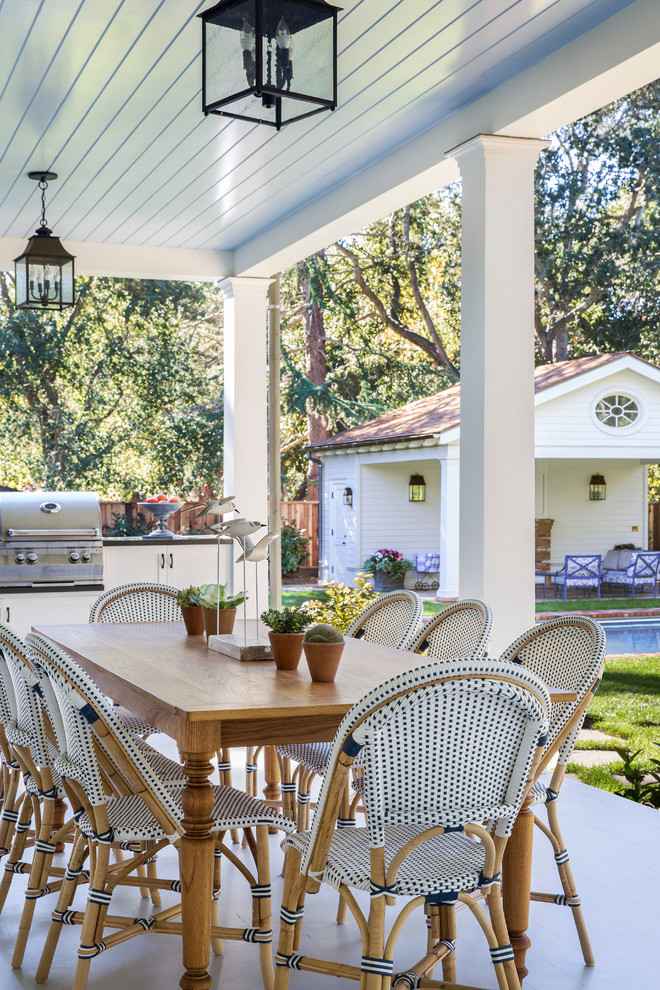 Atherton Residence - Inspiration for a mid-sized transitional backyard concrete patio remodel in San Francisco with a roof extension