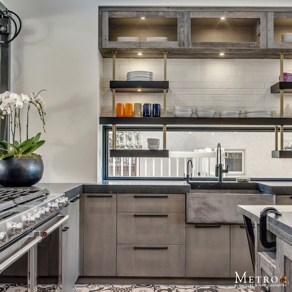 Mountain style u-shaped kitchen photo in Calgary with flat-panel cabinets, brown cabinets, stainless steel appliances and an island