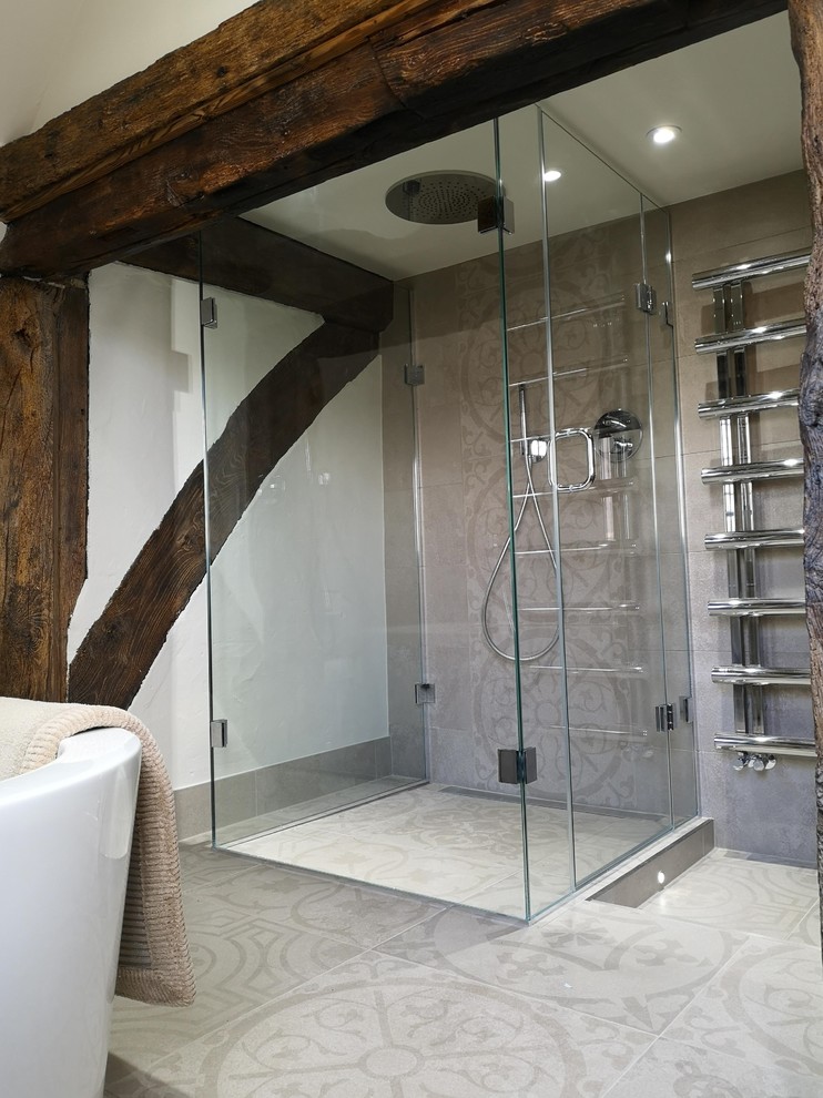 This is an example of a large country wet room bathroom in Kent with an open shower.