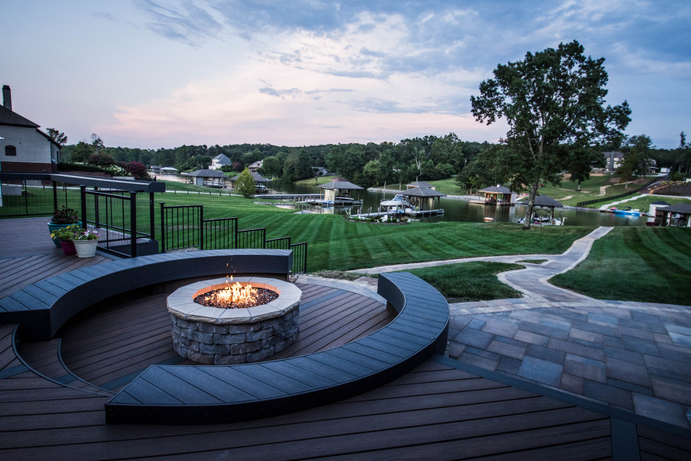 Design ideas for a large arts and crafts backyard deck in Other with a fire feature and no cover.