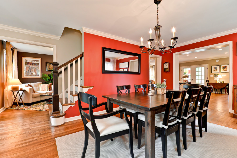 Transitional dining room in DC Metro with red walls.