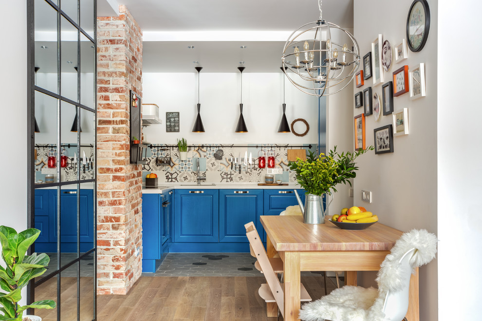 Design ideas for a small scandinavian u-shaped kitchen in Moscow with an undermount sink, raised-panel cabinets, blue cabinets, multi-coloured splashback, no island and white benchtop.