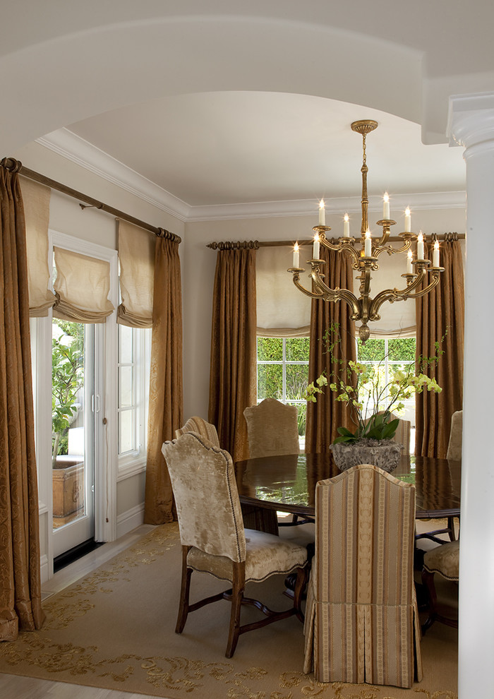 Design ideas for a traditional dining room in San Francisco with beige walls and carpet.