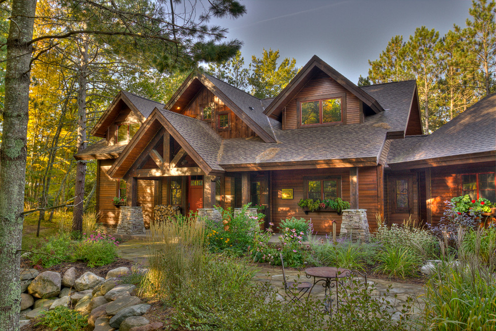 Inspiration for a country two-storey exterior in Minneapolis with wood siding.