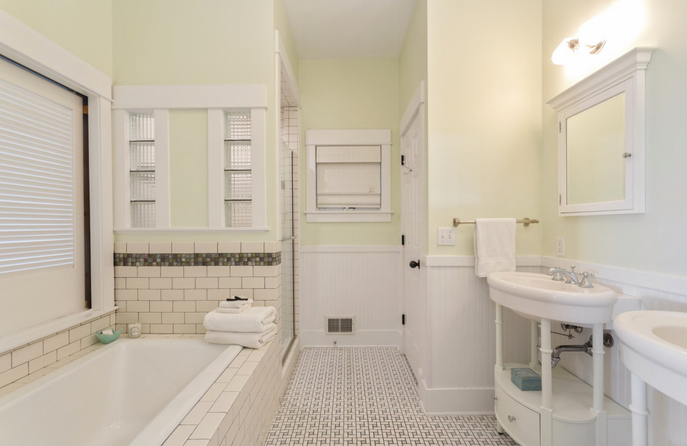 Inspiration for a mid-sized beach style master bathroom in Chicago with white cabinets, a drop-in tub, an alcove shower, yellow tile, yellow walls, ceramic floors, a pedestal sink, white floor, a hinged shower door, a double vanity and a freestanding vanity.