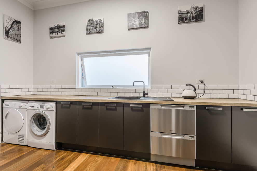 Transitional laundry room in Perth.