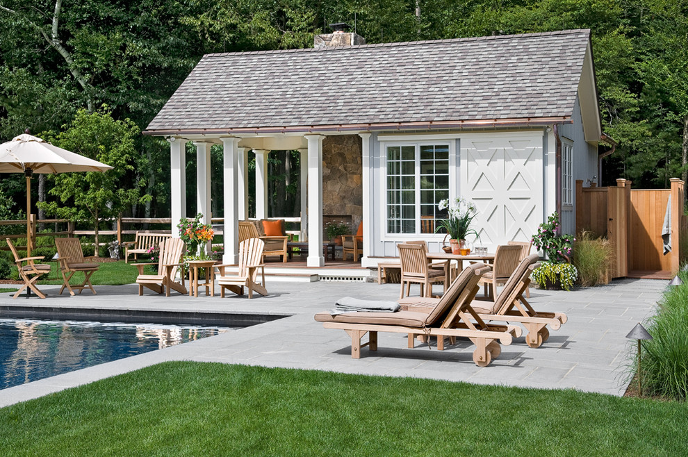 Photo of a country rectangular pool in New York with a pool house.
