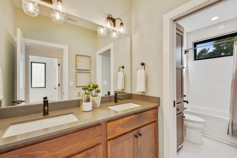 Inspiration for a country master bathroom in Austin with recessed-panel cabinets, medium wood cabinets, an alcove tub, an alcove shower, white tile, subway tile, white walls, a hinged shower door, an enclosed toilet and a double vanity.