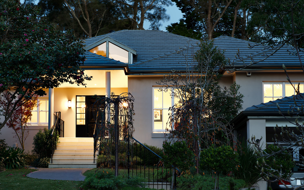 Design ideas for a large contemporary two-storey concrete beige house exterior in Sydney with a gable roof and a tile roof.