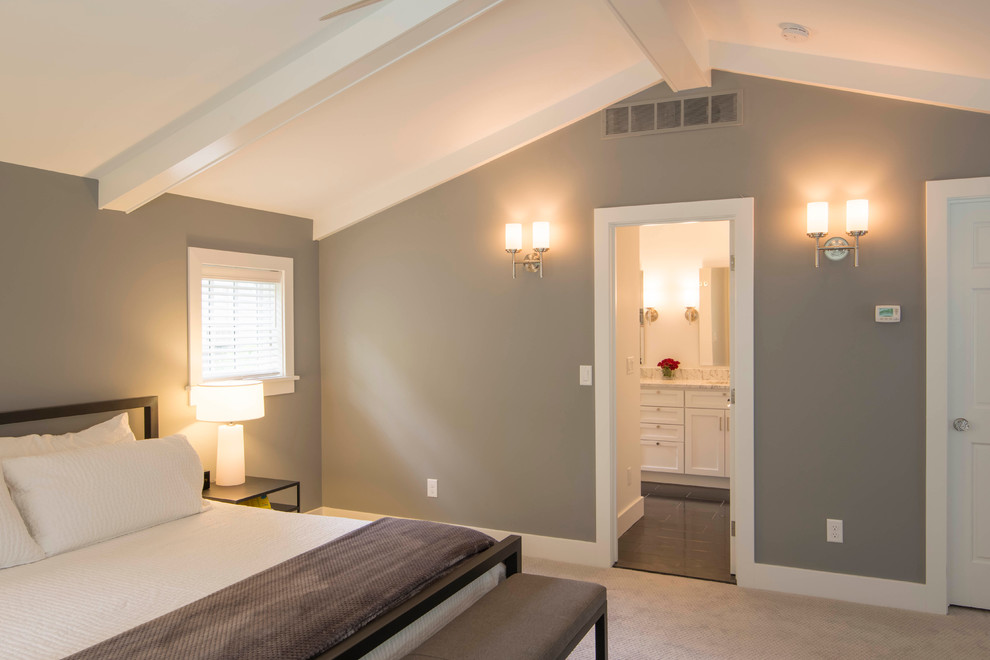 This is an example of a mid-sized transitional master bedroom in Detroit with grey walls, carpet and no fireplace.