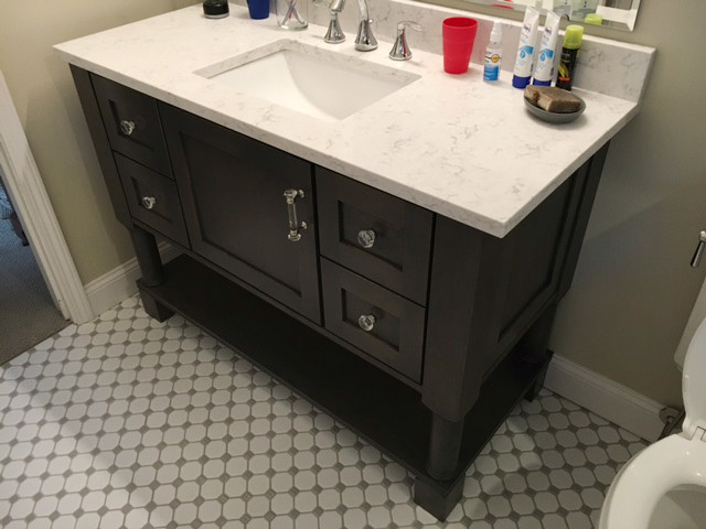 Photo of a small contemporary master bathroom in Other with shaker cabinets, grey cabinets, an alcove shower, a one-piece toilet, gray tile, subway tile, grey walls, mosaic tile floors, an undermount sink, engineered quartz benchtops, white floor and a hinged shower door.