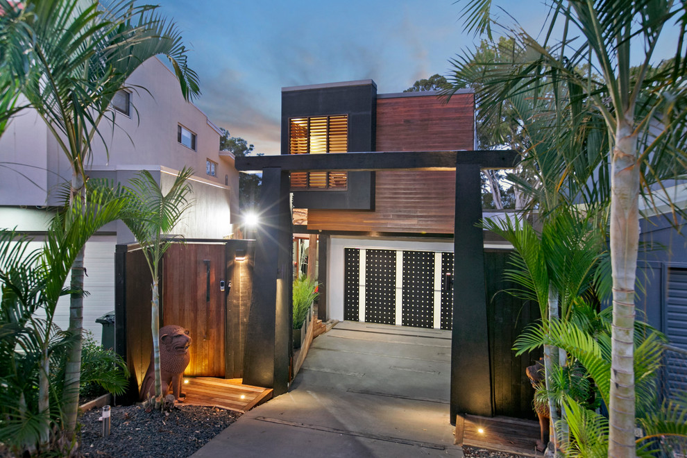Design ideas for a large contemporary two-storey brown exterior in Brisbane with mixed siding and a flat roof.