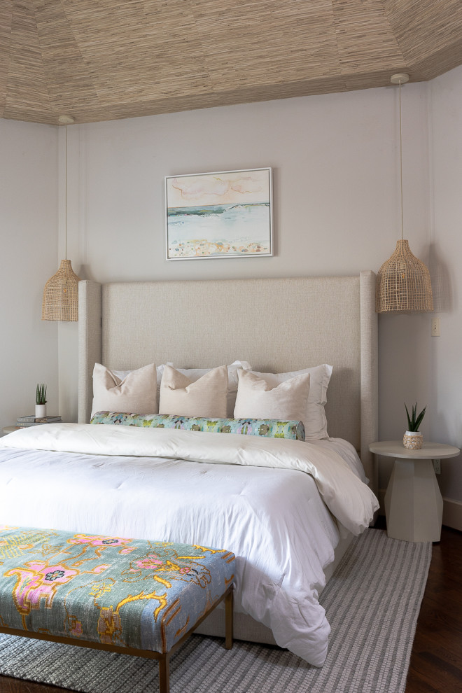Beach style master bedroom in Houston with beige walls, wallpaper, vaulted, dark hardwood floors and brown floor.