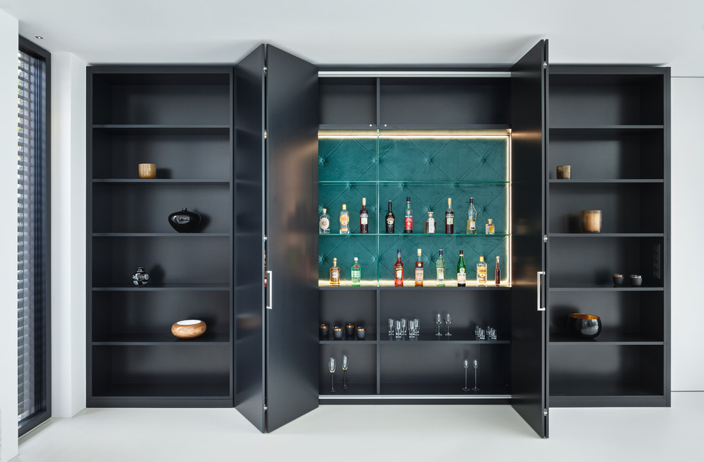 Design ideas for a mid-sized contemporary single-wall home bar in Munich with open cabinets, black cabinets, no sink, green splashback and grey floor.