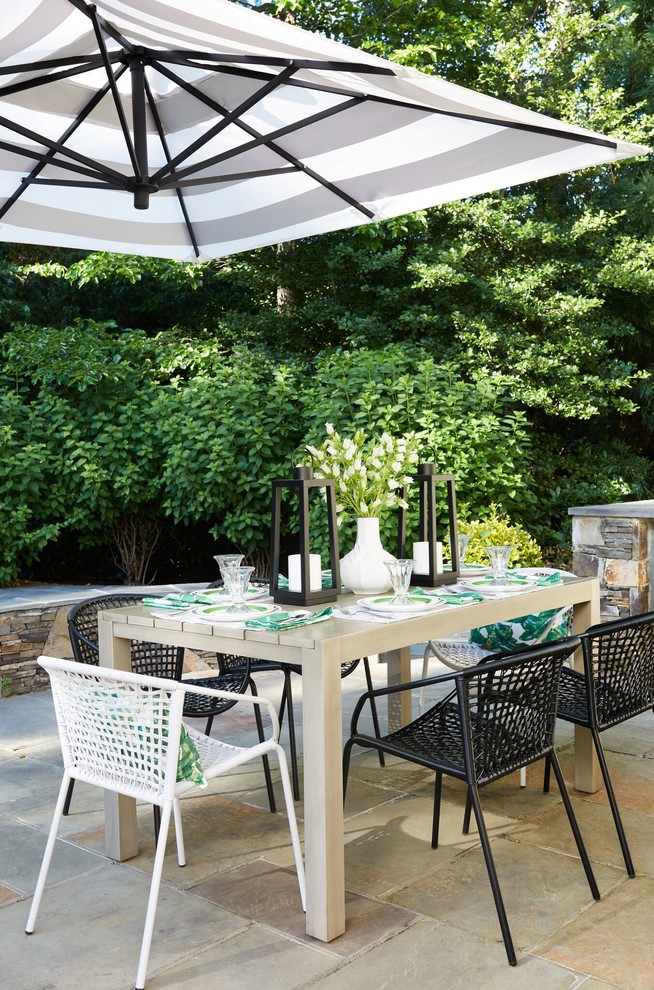 Design ideas for a transitional backyard patio in DC Metro with tile and no cover.