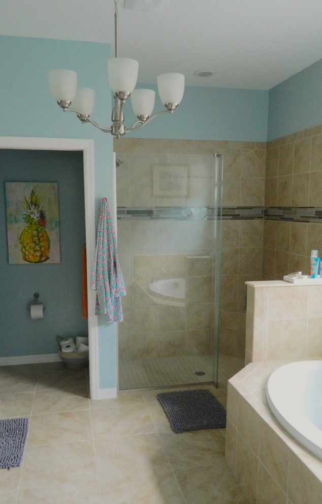 Design ideas for a mid-sized transitional master bathroom in Tampa with beaded inset cabinets, white cabinets, a drop-in tub, an open shower, a two-piece toilet, beige tile, porcelain tile, blue walls, porcelain floors, an undermount sink, granite benchtops, beige floor, an open shower and beige benchtops.
