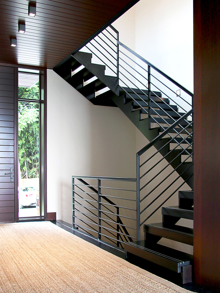 Inspiration for a mid-sized contemporary wood floating staircase in DC Metro with open risers.