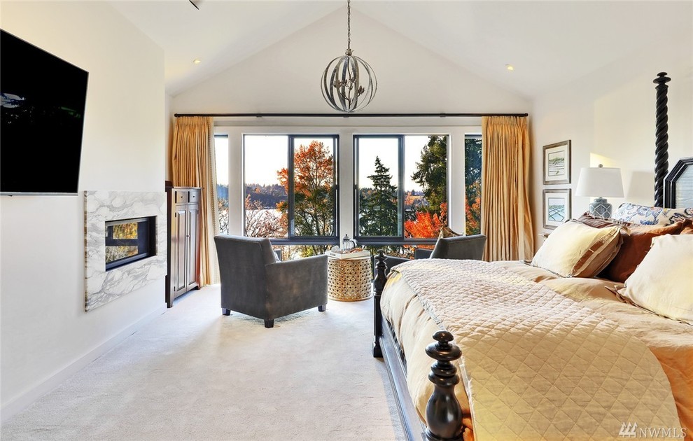 Photo of a large contemporary master bedroom in Seattle with white walls, carpet, a ribbon fireplace and a stone fireplace surround.