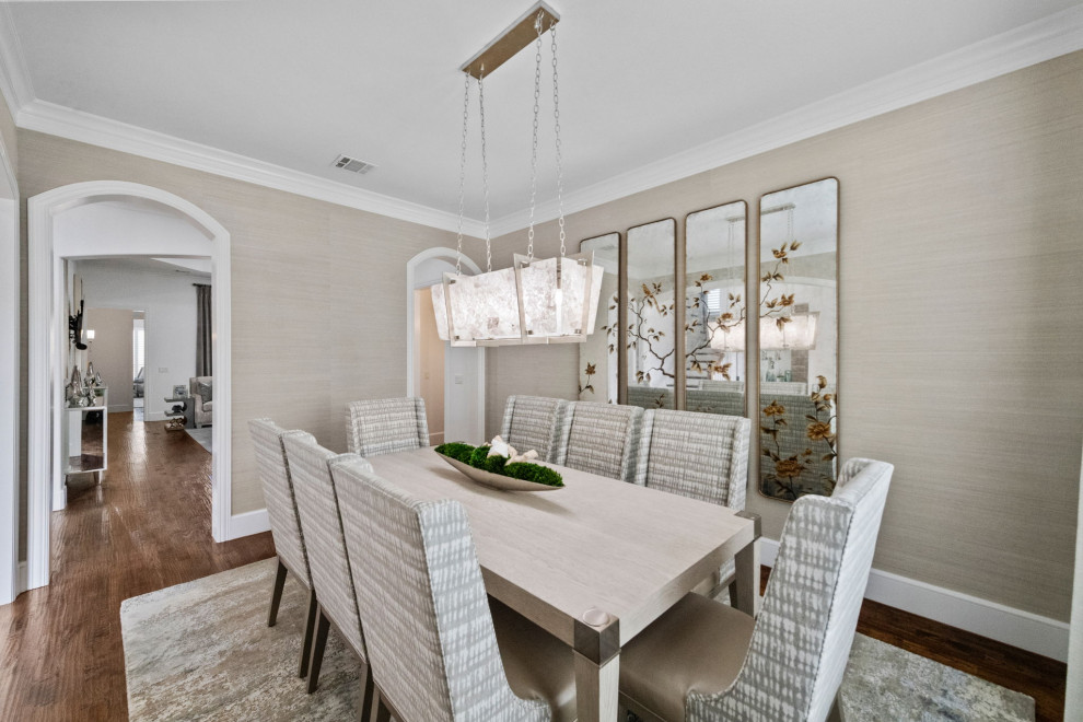 Inspiration for a mid-sized contemporary medium tone wood floor, brown floor and wallpaper enclosed dining room remodel in Dallas with brown walls