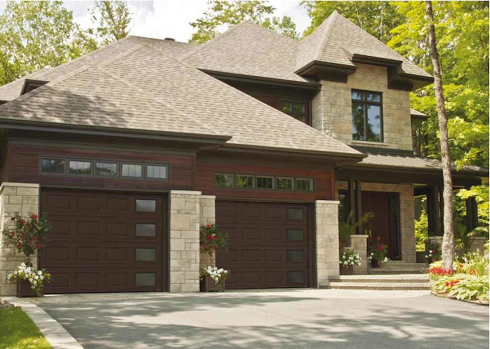 Inspiration for a mid-sized traditional attached two-car garage in Cedar Rapids.