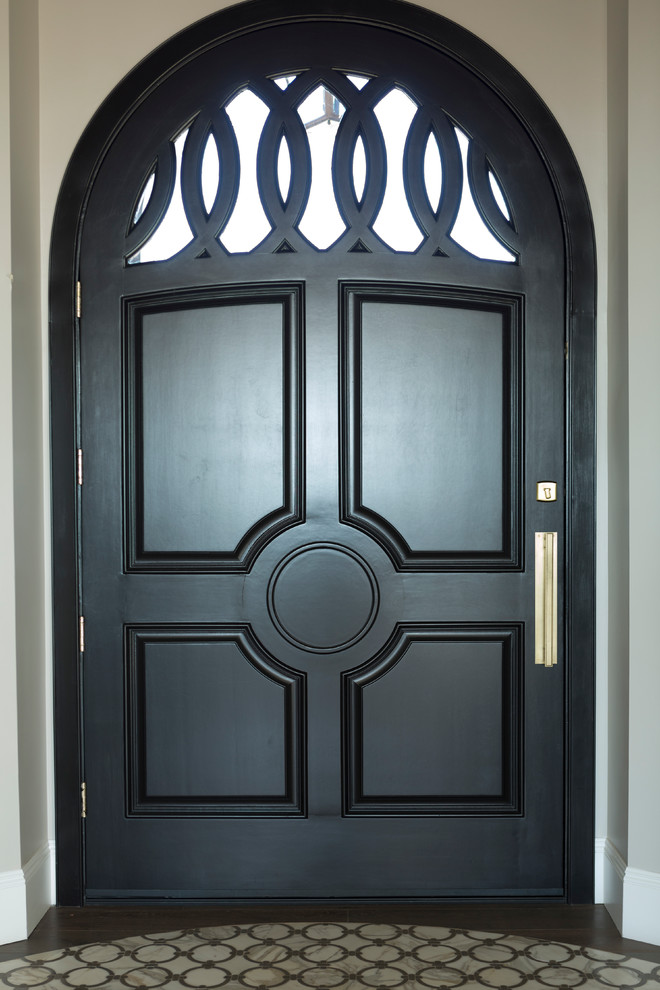 Inspiration for a large transitional front door in Phoenix with beige walls, dark hardwood floors, a single front door, a black front door and brown floor.