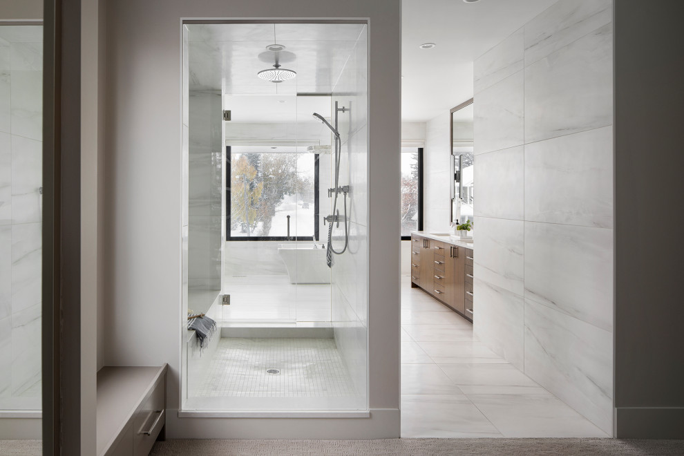 Freestanding bathtub - large modern master double-sink and porcelain tile freestanding bathtub idea in Calgary with flat-panel cabinets, quartz countertops, white countertops, a built-in vanity and an undermount sink