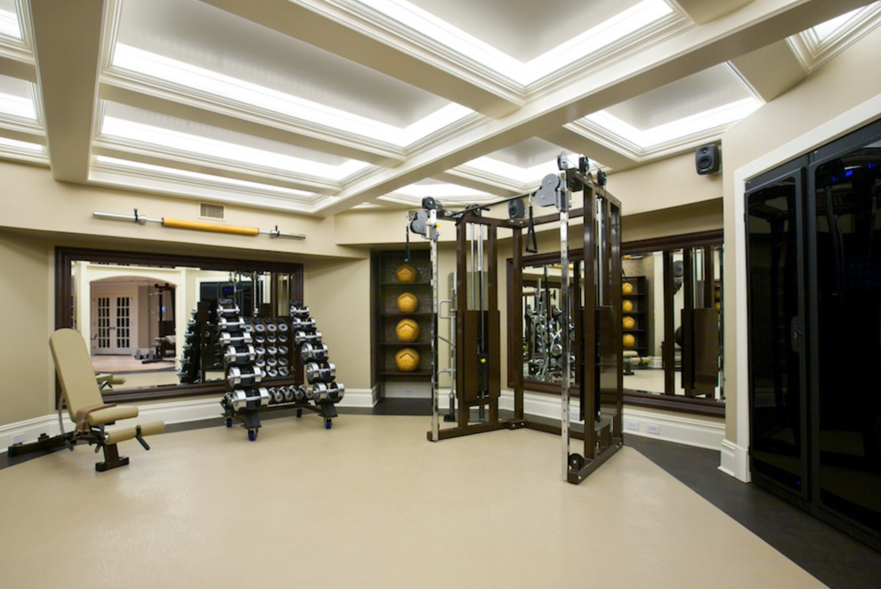Large traditional home weight room in New York with beige walls and coffered.