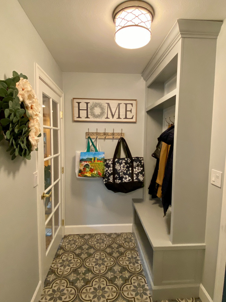 Inspiration for a mid-sized country l-shaped dedicated laundry room in Portland with an undermount sink, recessed-panel cabinets, white cabinets, quartz benchtops, blue walls, porcelain floors, a side-by-side washer and dryer, blue floor and beige benchtop.