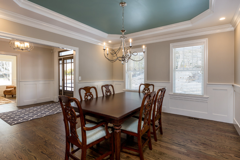 Design ideas for a mid-sized transitional separate dining room in Boston with dark hardwood floors and beige walls.