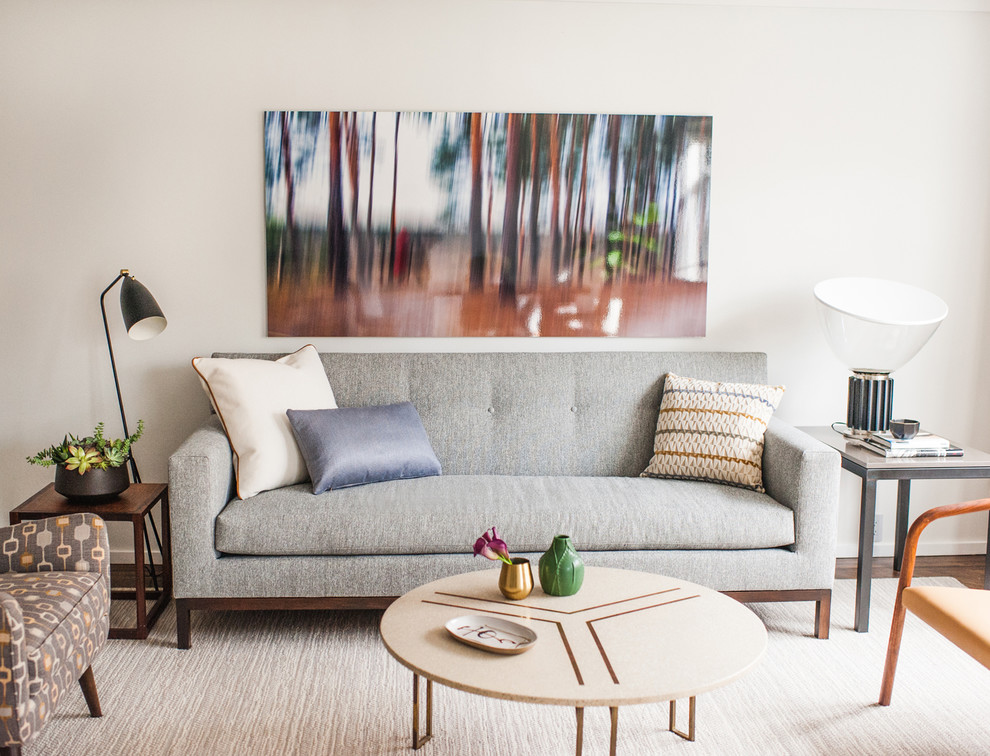 Example of a mid-sized 1960s formal and open concept carpeted living room design in New York with gray walls, no fireplace and no tv