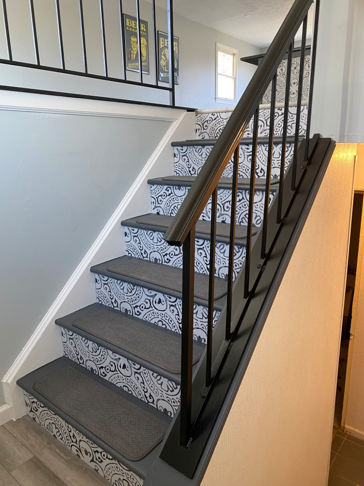 Staircase - large transitional l-shaped vinyl floor and gray floor staircase idea in Cincinnati with an undermount sink, raised-panel cabinets, white cabinets, granite countertops, multicolored backsplash, ceramic backsplash, stainless steel appliances, an island and black countertops