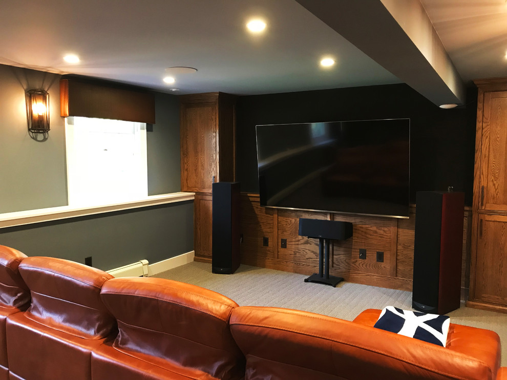 Mid-sized traditional enclosed home theatre in New York with grey walls, carpet, a wall-mounted tv and white floor.