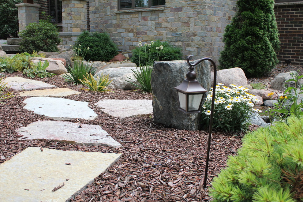 Inspiration for a country backyard partial sun garden for summer in Other with a fire feature and natural stone pavers.