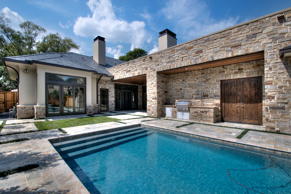 This is an example of a mediterranean rectangular pool in Houston with natural stone pavers.