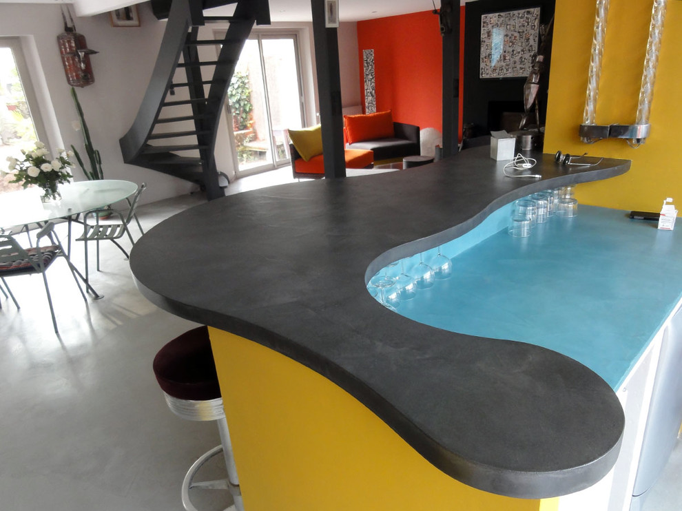 Photo of a large contemporary l-shaped seated home bar in Nantes with concrete benchtops, concrete floors, blue splashback and grey floor.