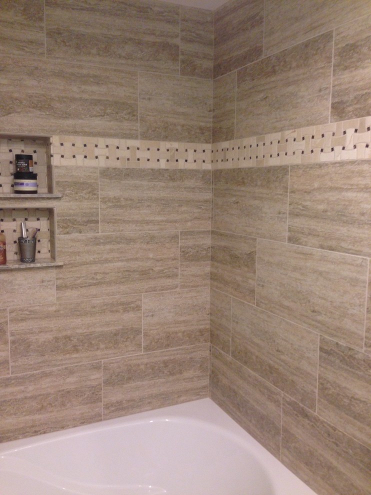 Design ideas for a small traditional master bathroom in Denver with raised-panel cabinets, brown cabinets, an alcove tub, an alcove shower, a two-piece toilet, brown tile, travertine, green walls, ceramic floors, an undermount sink and granite benchtops.