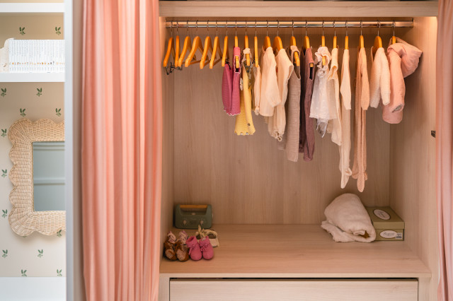 Open Wardrobe with Baby Clothes transitional-bedroom